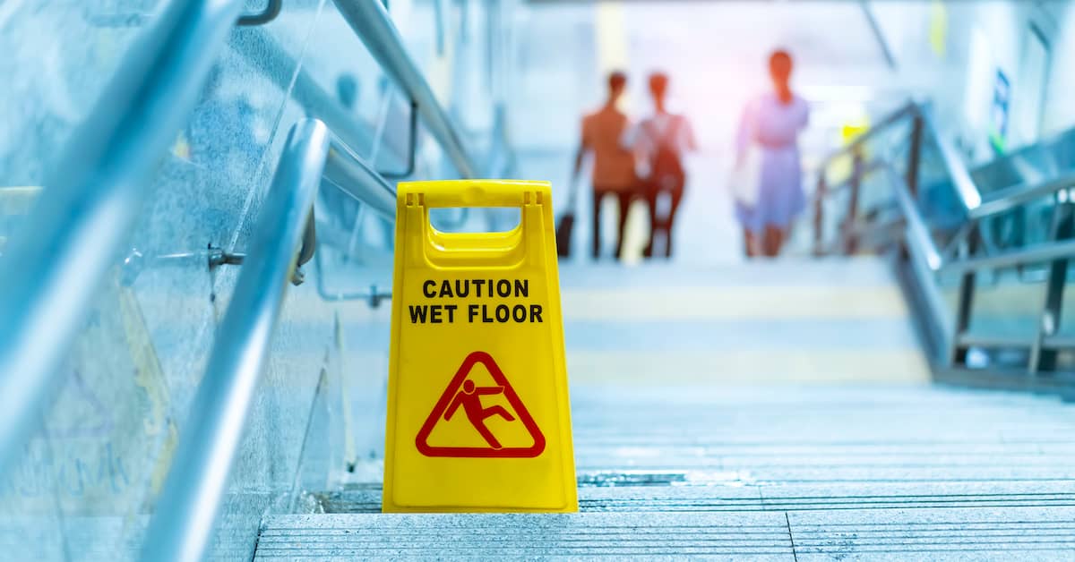 Floor Sign Warning of Slip and Fall Risk | Roberts Wilson, P.A.