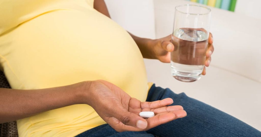 a pregnant woman about to take acetaminophen | Roberts Wilson, P.A.