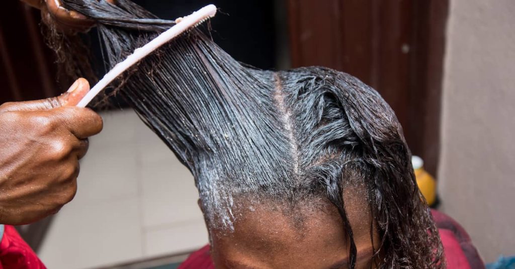 a woman gets chemical hair straightener treatment | Roberts Wilson, P.A.