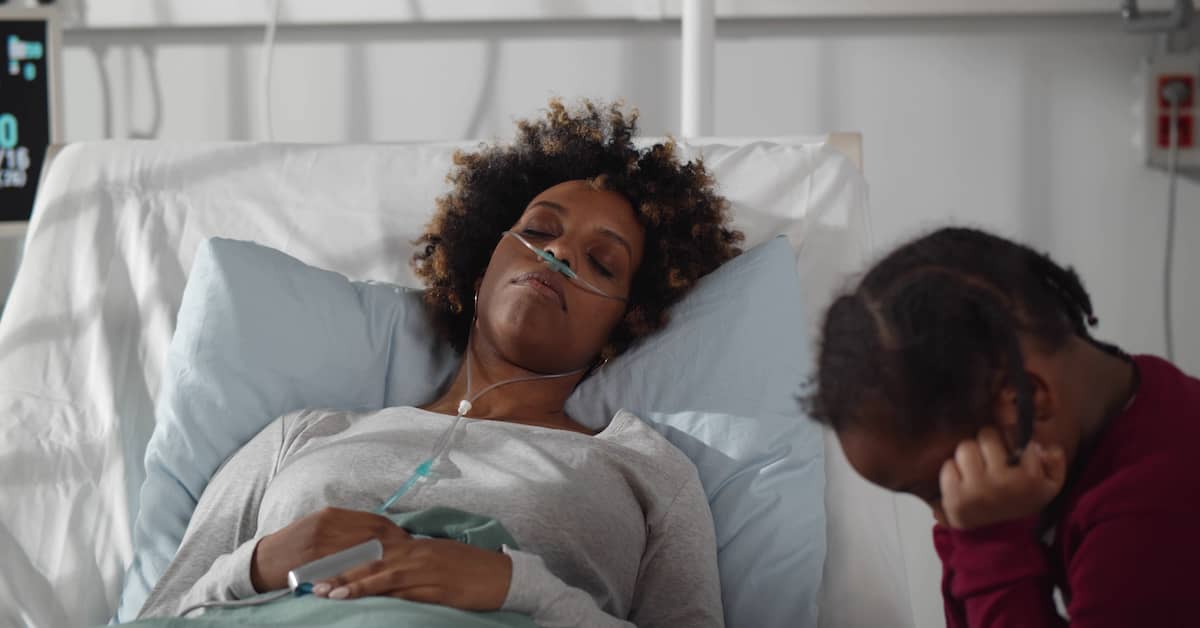 a woman rests in a hospital bed | Roberts Wilson, P.A.